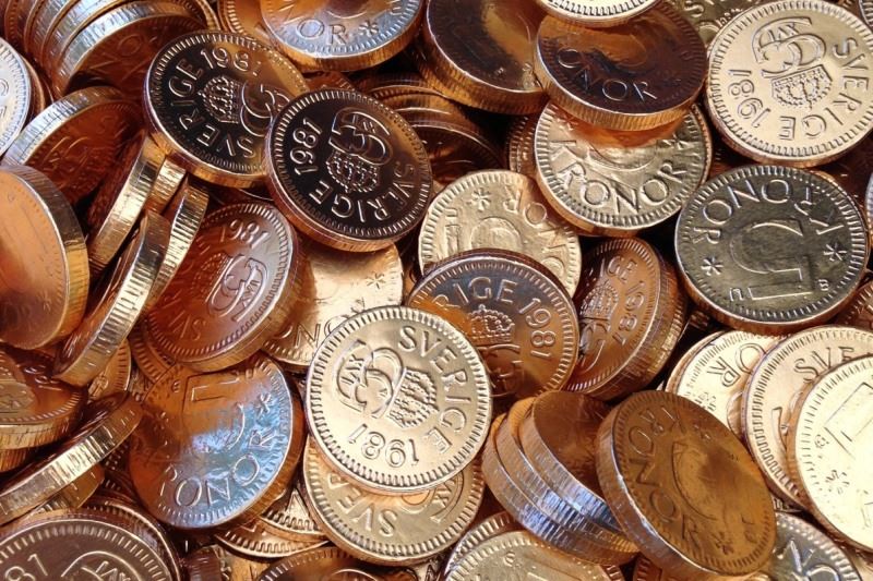 Massor med mynt som ska representera utbetalning av elstöd
